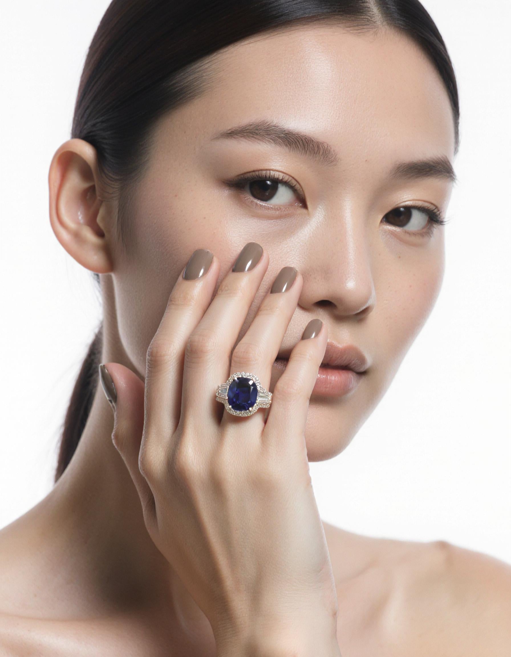 "Lirine" Cushion cut Blue Sapphire with tapered baguette Diamonds with an Halo Ring