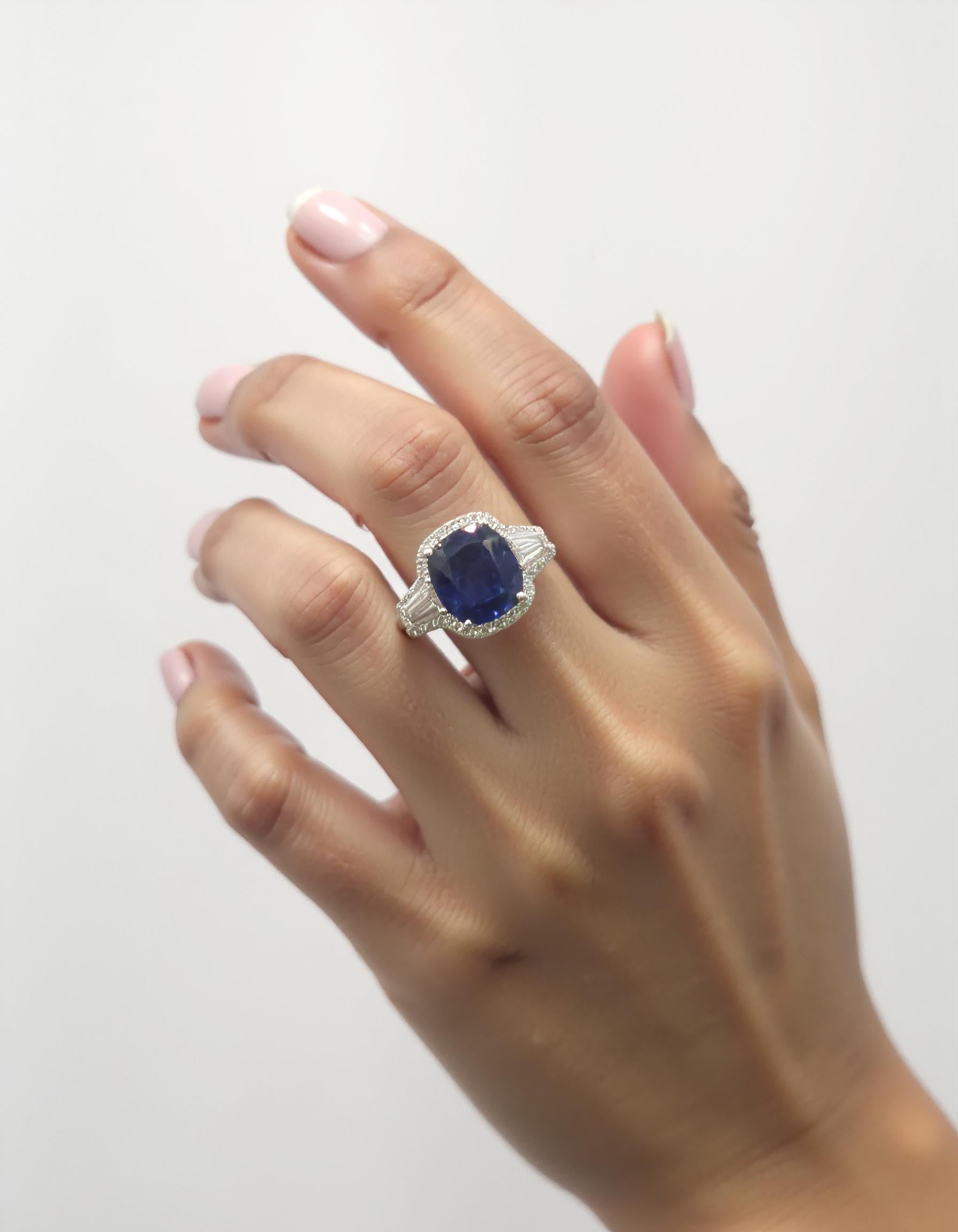 "Lirine" Cushion cut Blue Sapphire with tapered baguette Diamonds with an Halo Ring