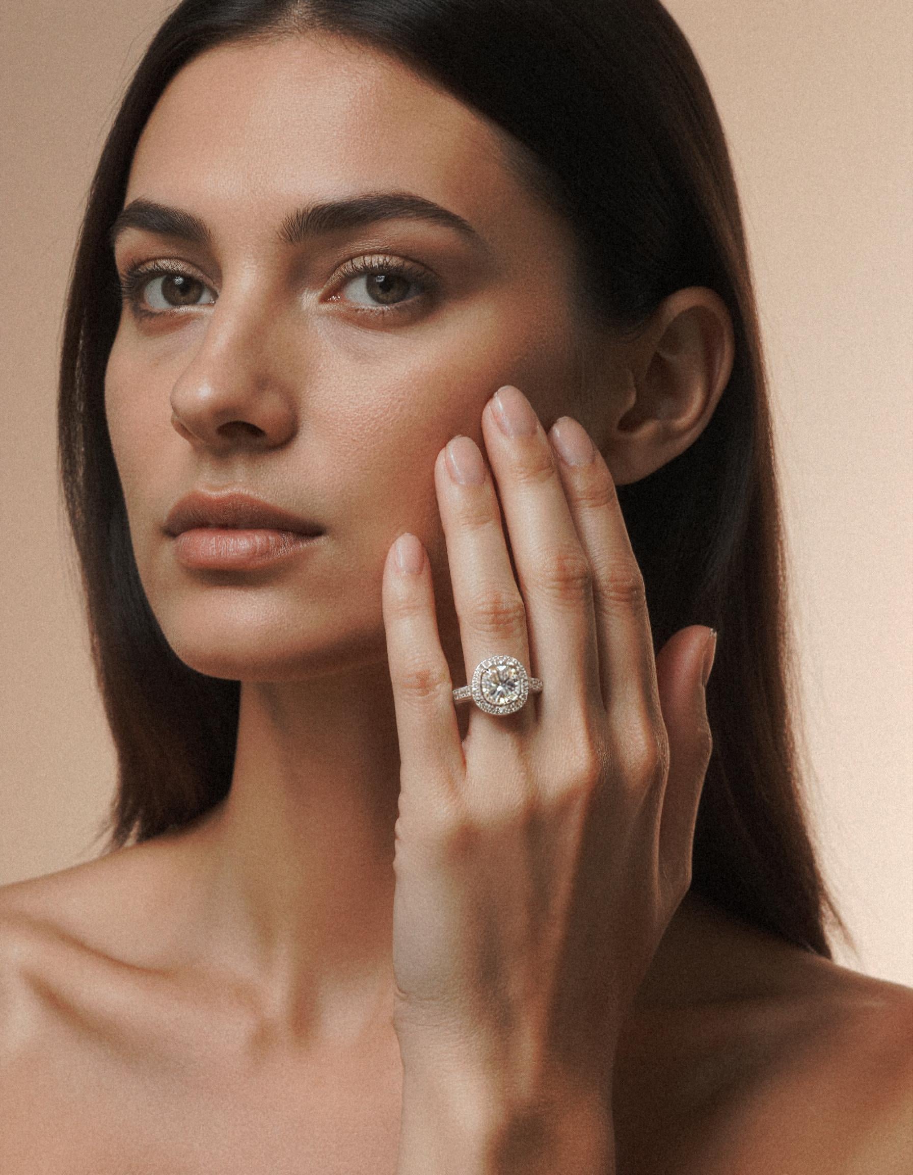 "Nareta" Cushion cut Center stone with Round Brilliant Halo Engagement Ring