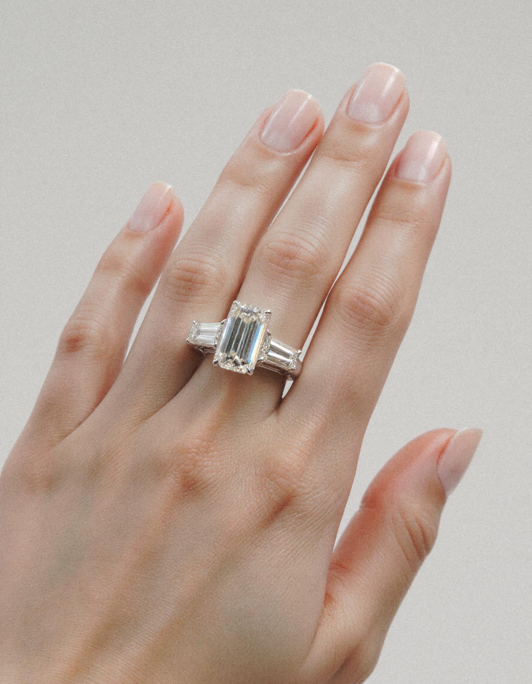"Allegra" 3 stone Diamond ring With Emerald cut center and Tapered Baguette side stones