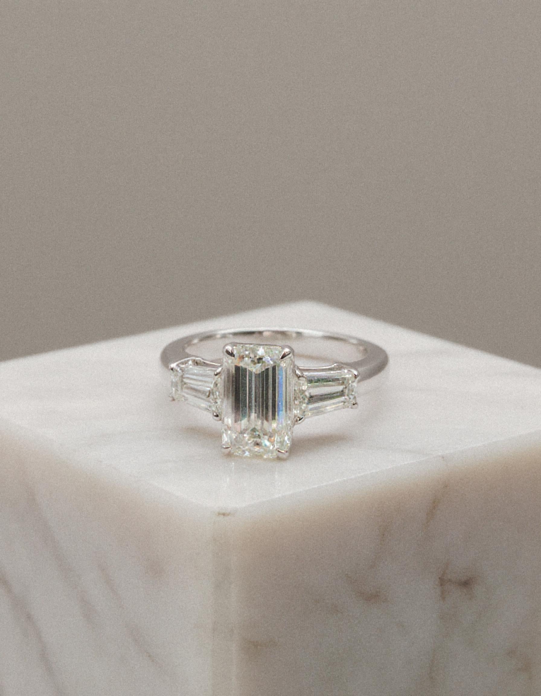 "Allegra" 3 stone Diamond ring With Emerald cut center and Tapered Baguette side stones