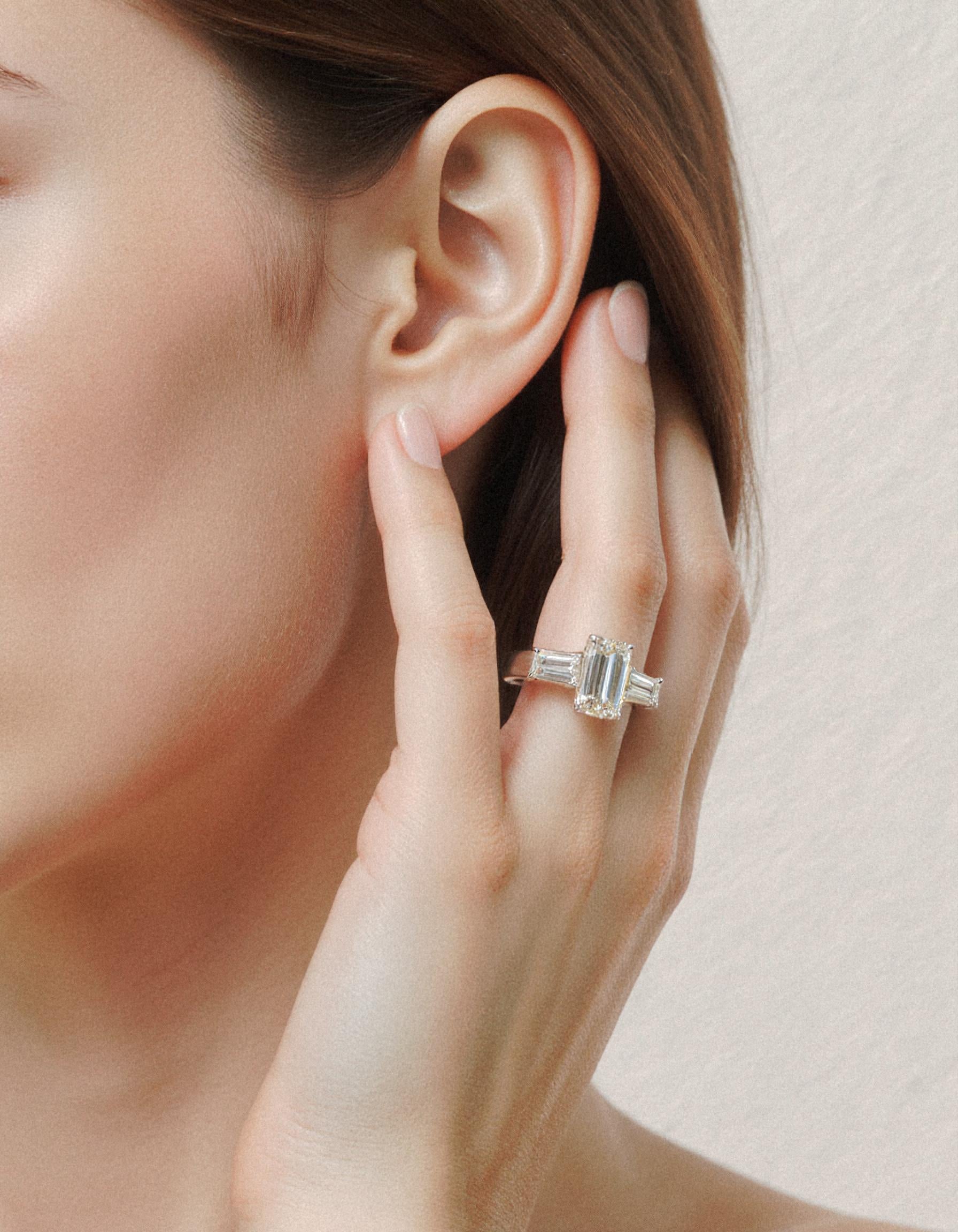 "Allegra" 3 stone Diamond ring With Emerald cut center and Tapered Baguette side stones