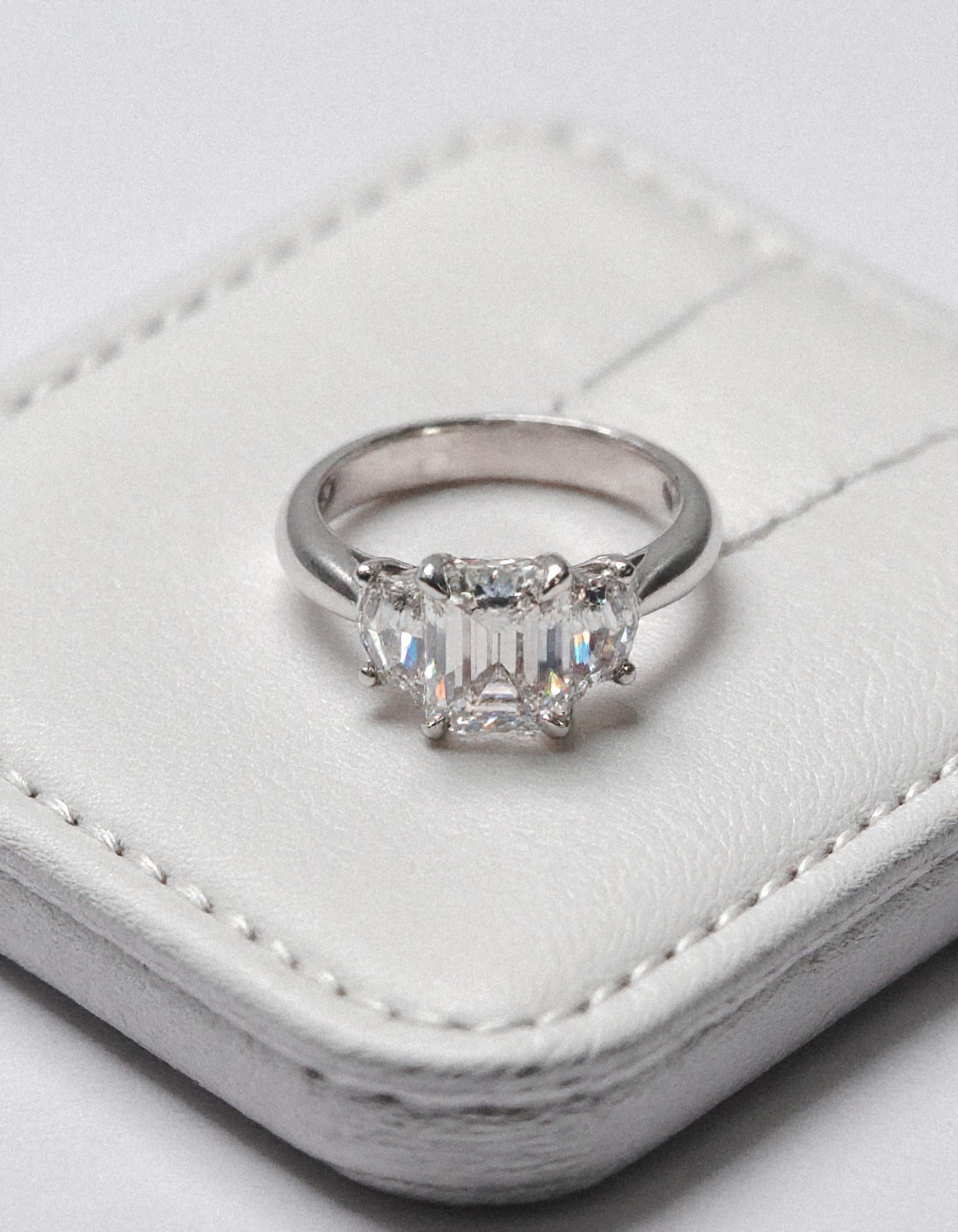 "Ivara" 3 stone Diamond ring With Emerald cut center and Cadillac cut side stones