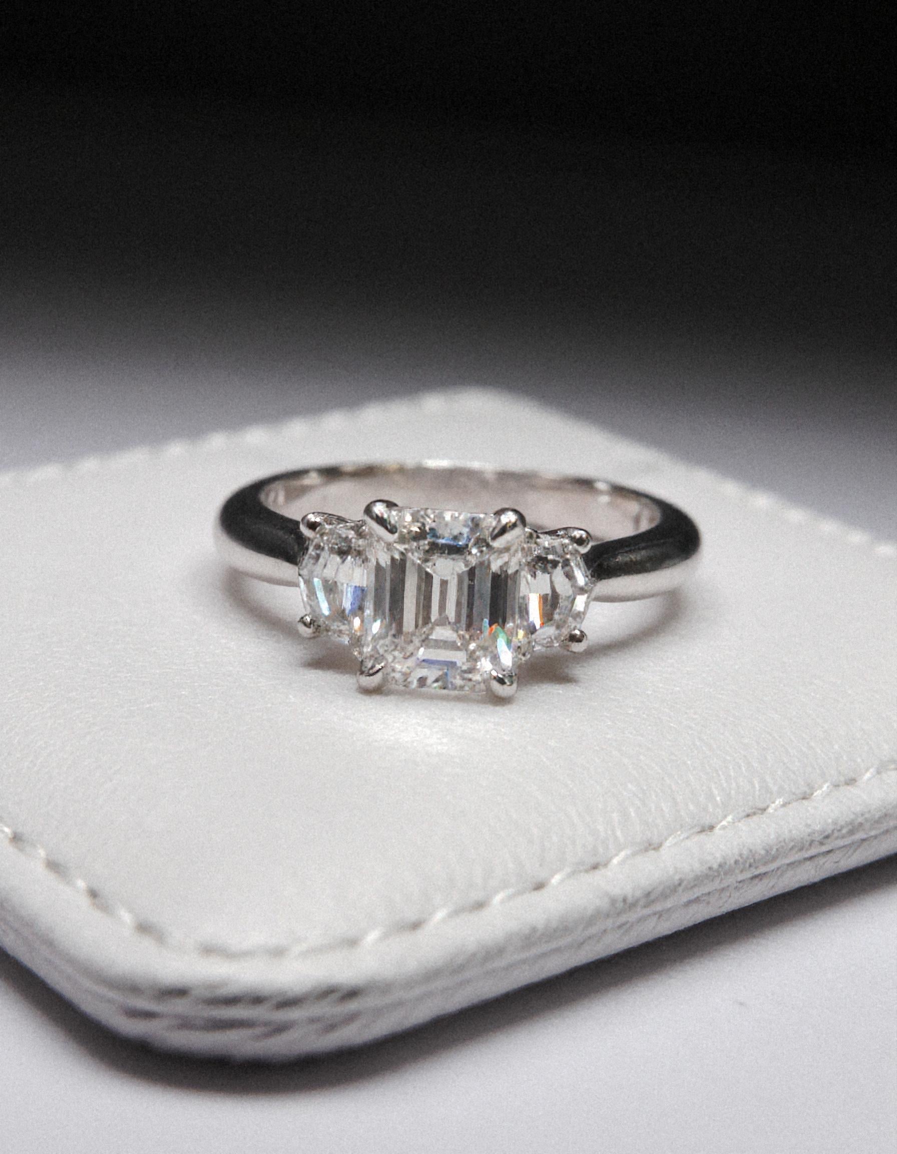 "Ivara" 3 stone Diamond ring With Emerald cut center and Cadillac cut side stones