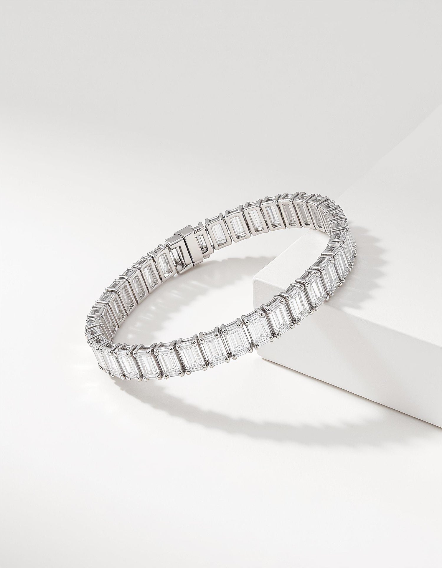 &quot;Renja&quot; Emerald Cut Classic Basket Prong set Tennis Bracelet