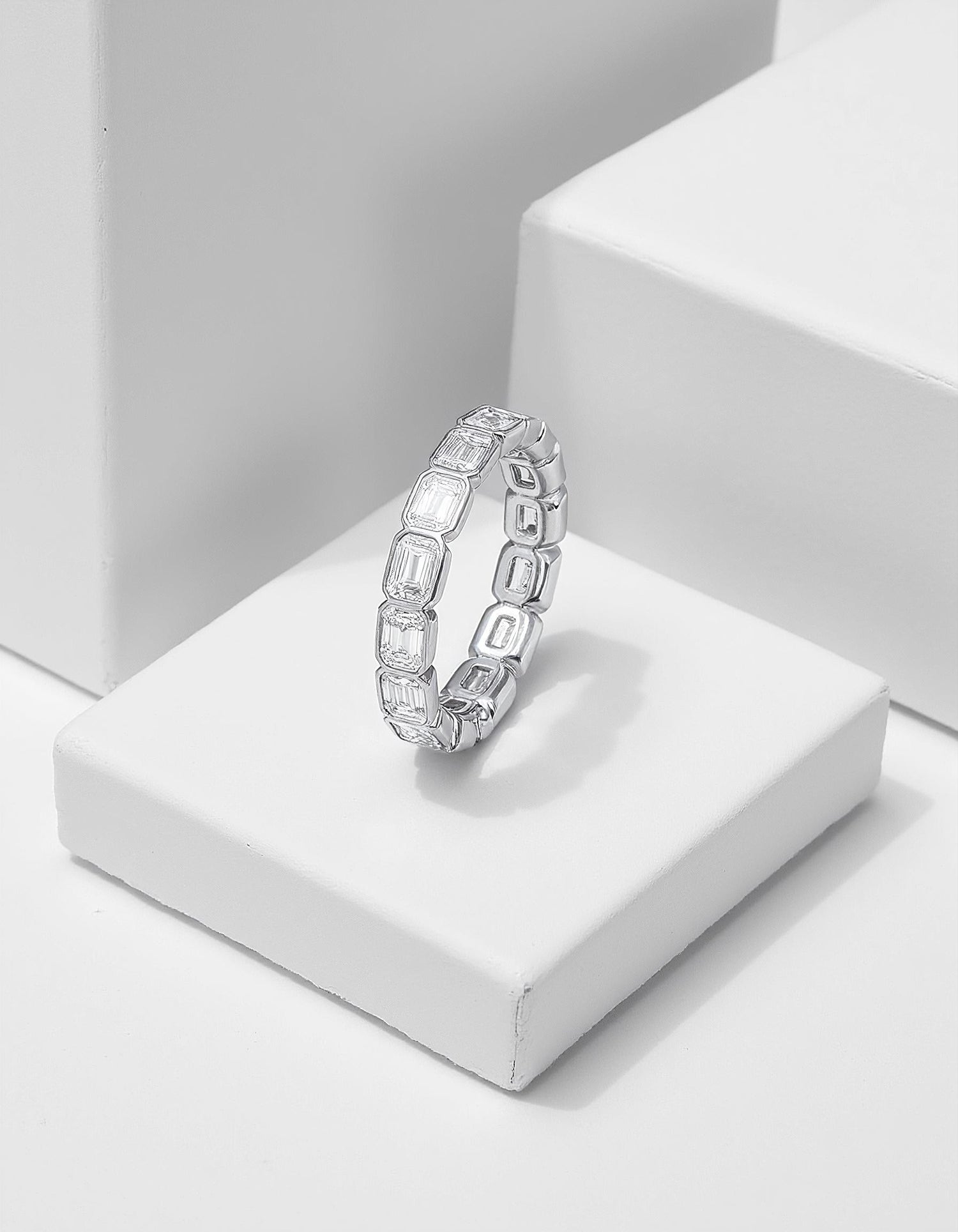 &quot;Aria&quot; Horizontally set Emerald cut Bezel set Eternity Band