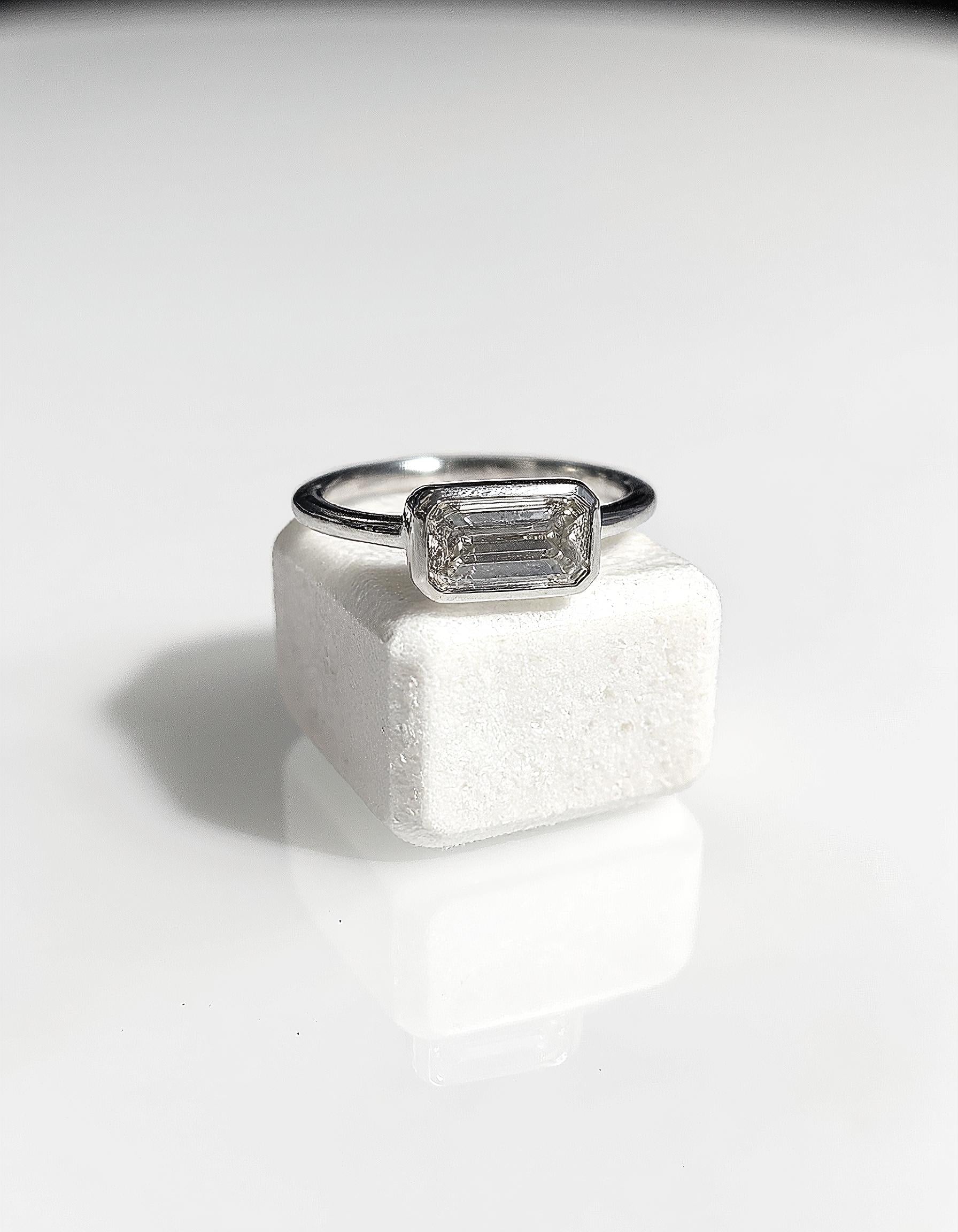 &quot;Lana&quot; Emerald Cut diamond solitaire in Bezel setting set Horizontally