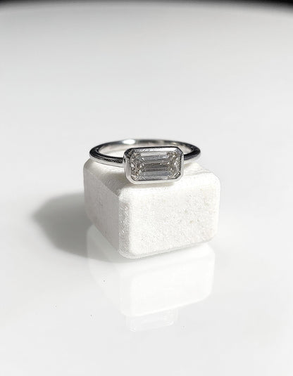 &quot;Lana&quot; Emerald Cut diamond solitaire in Bezel setting set Horizontally