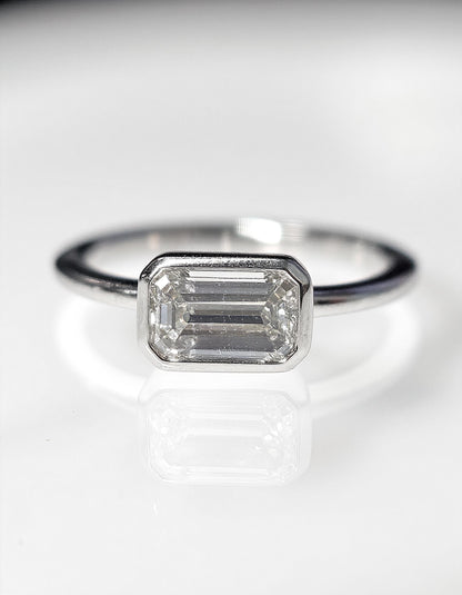 &quot;Lana&quot; Emerald Cut diamond solitaire in Bezel setting set Horizontally