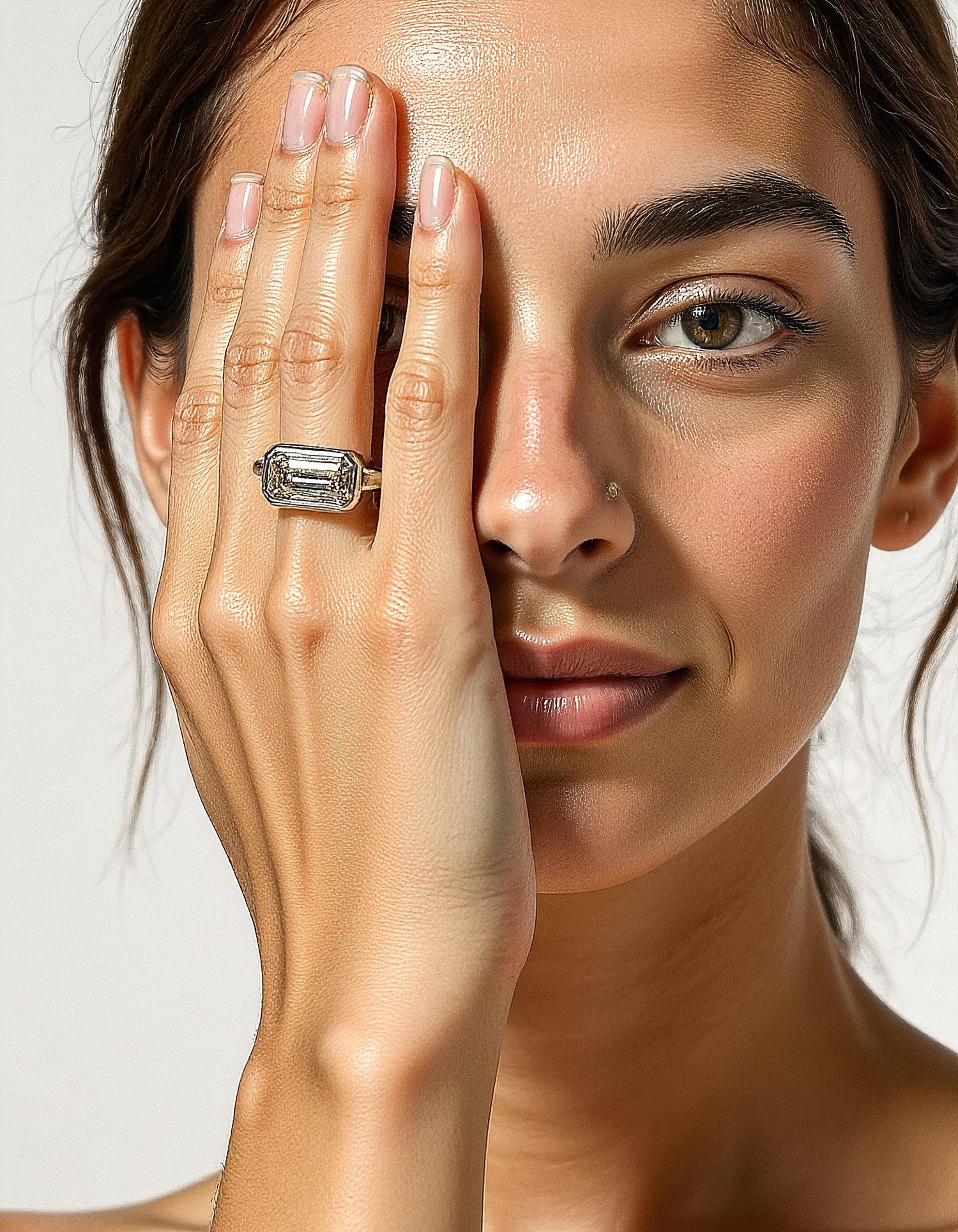 &quot;Lana&quot; Emerald Cut diamond solitaire in Bezel setting set Horizontally