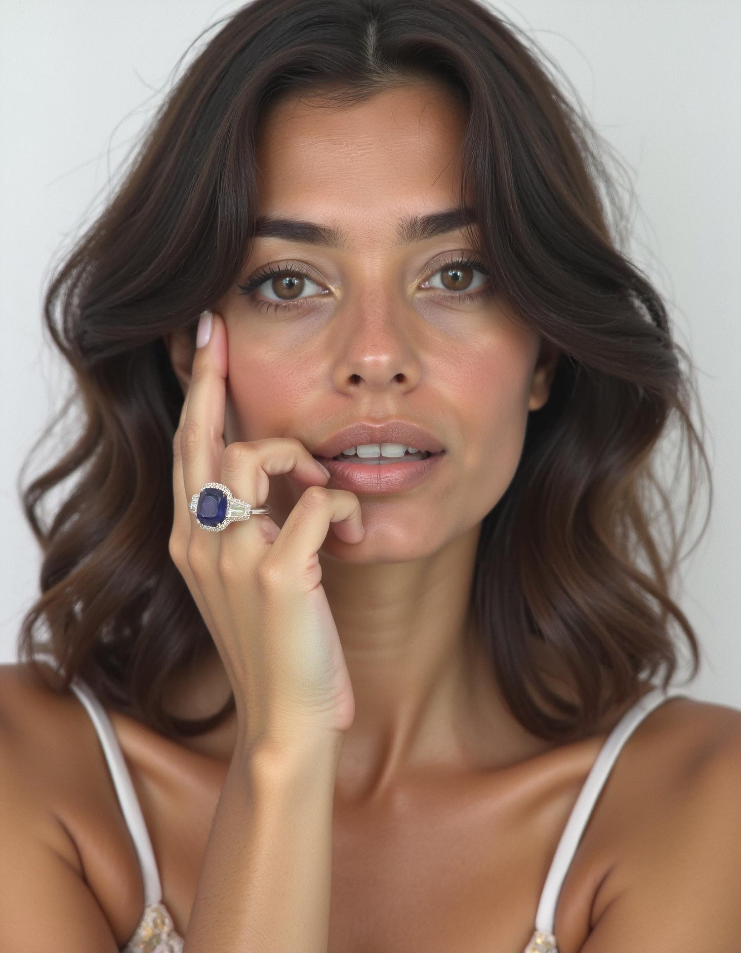 &quot;Lirine&quot; Cushion cut Blue Sapphire with tapered baguette Diamonds with an Halo Ring