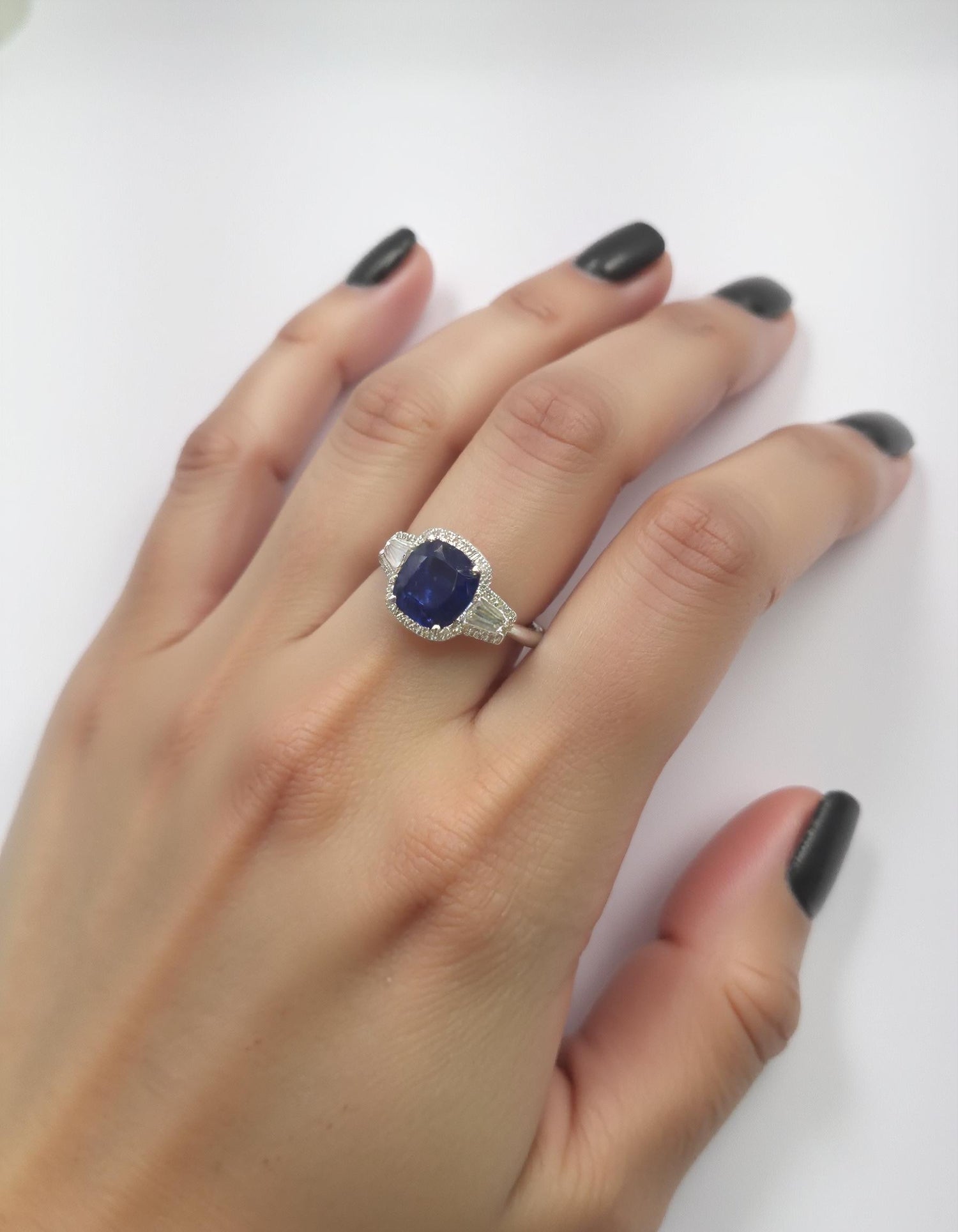 &quot;Lirine&quot; Cushion cut Blue Sapphire with tapered baguette Diamonds with an Halo Ring