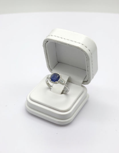 &quot;Lirine&quot; Cushion cut Blue Sapphire with tapered baguette Diamonds with an Halo Ring