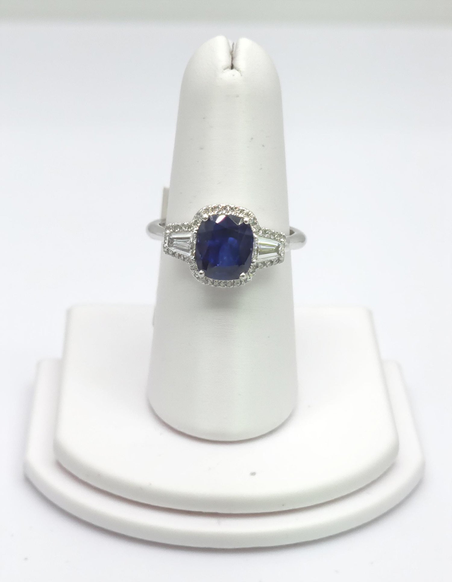 &quot;Lirine&quot; Cushion cut Blue Sapphire with tapered baguette Diamonds with an Halo Ring