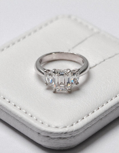 &quot;Ivara&quot; 3 stone Diamond ring With Emerald cut center and Cadillac cut side stones