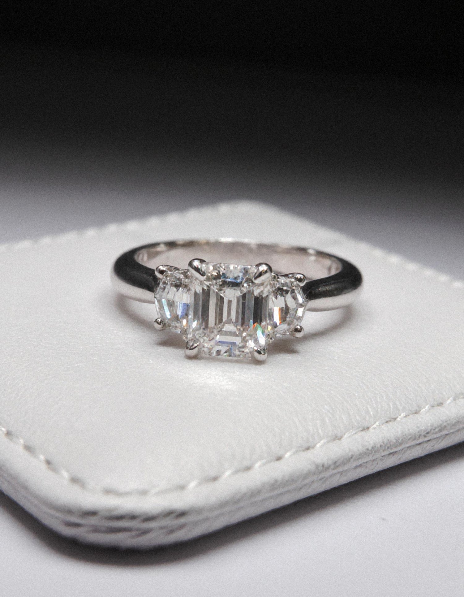 &quot;Ivara&quot; 3 stone Diamond ring With Emerald cut center and Cadillac cut side stones