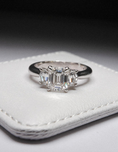 &quot;Ivara&quot; 3 stone Diamond ring With Emerald cut center and Cadillac cut side stones