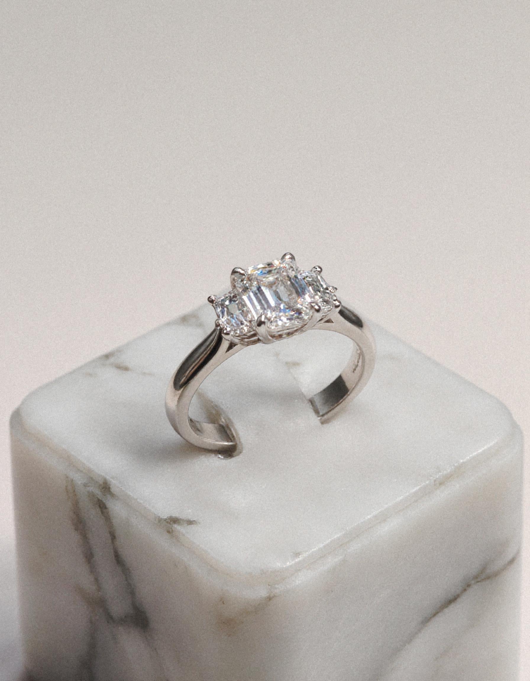 &quot;Ivara&quot; 3 stone Diamond ring With Emerald cut center and Cadillac cut side stones