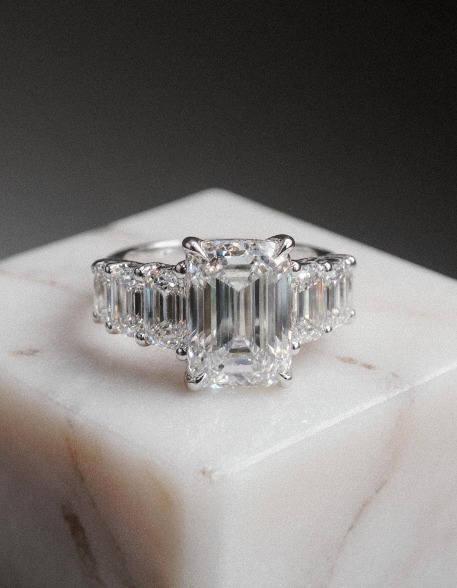 &quot;Rozalin&quot; 7 Stone Emerald cut Graduated Prong Set Engagement Ring